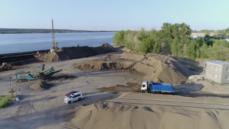 sand and gravel port with heavy machinery