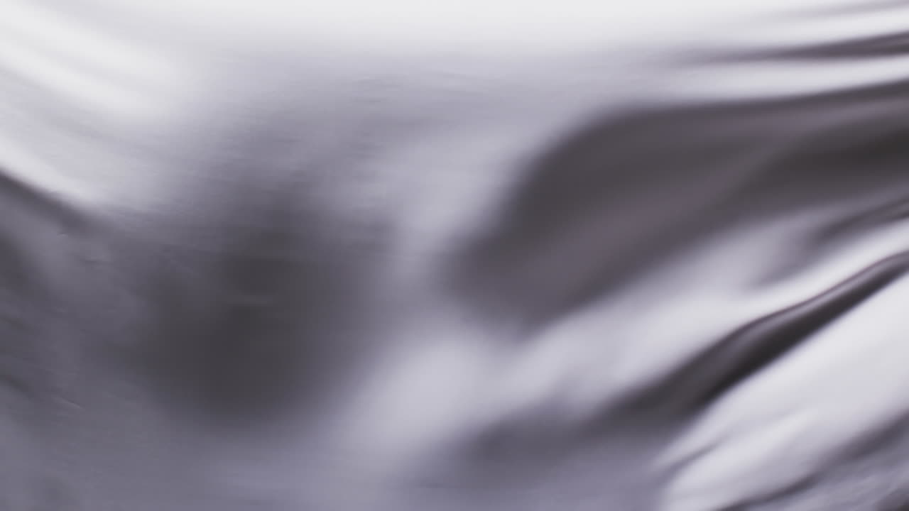 검은색 배경 위에 복사 공간과 함께  ⁇ 색 천을 불어 넣는 애니메이션