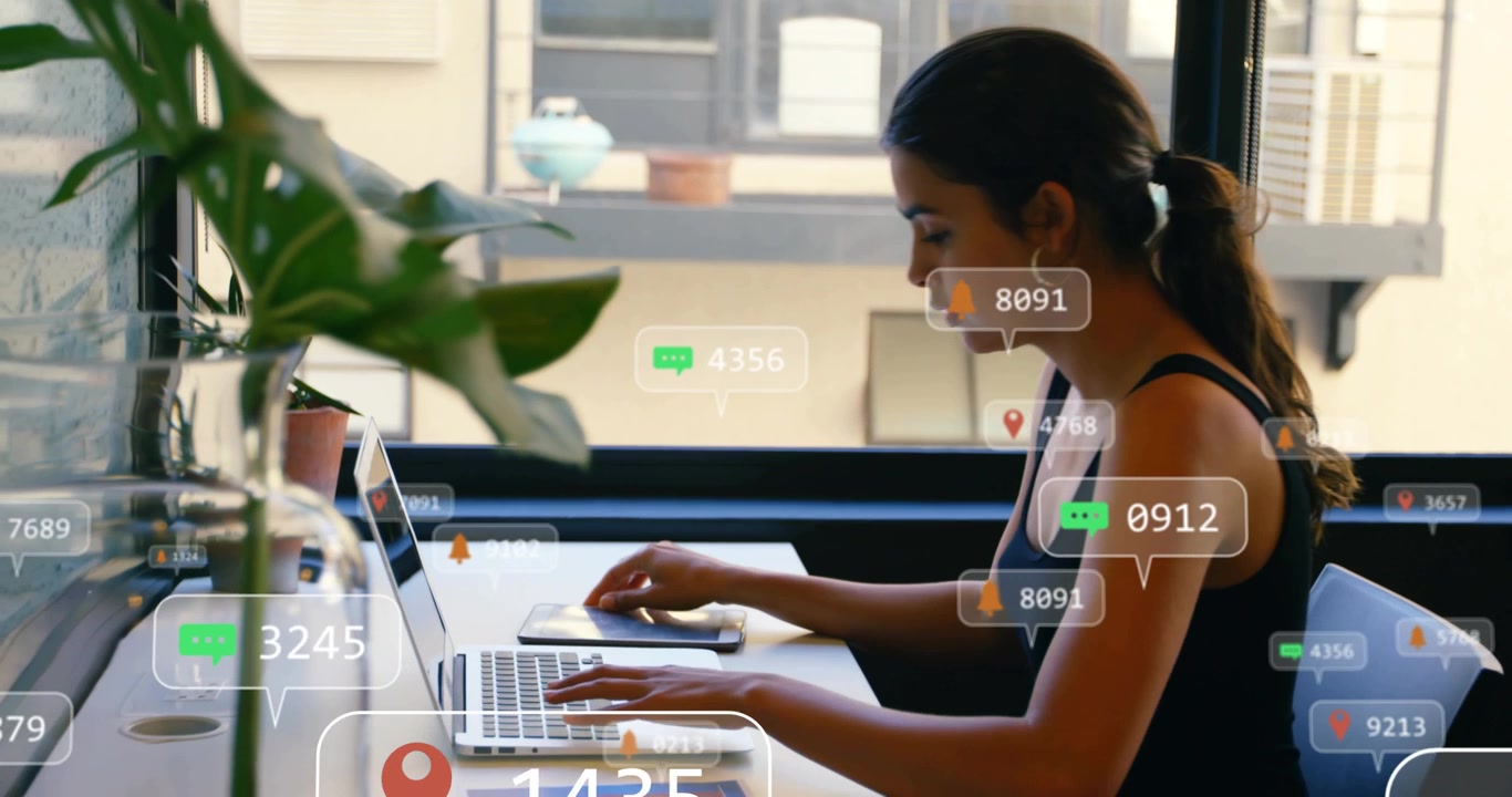 Young Woman Working on Laptop with Digital Social Media Notifications