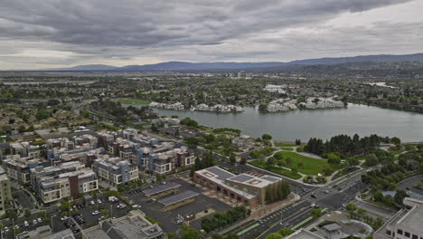 foster city california aerial v3 drone flyover town center capturing central lake and lakeside residential neighborhood with waterfront apartment complex - shot with mavic 3 cine - june 2022