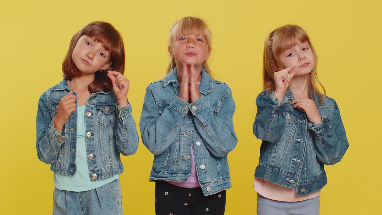 Three girls siblings friends praying making wish begging apology forgiveness help