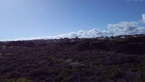 Aerial-orbit-around-artificial-eagles-nest-near-coastal-path-with-lense-flare