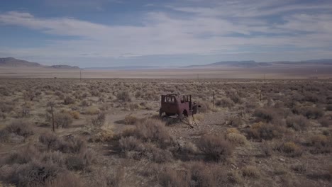 nevada desert near great basin national park sits the old rusted remains of an early american automobile.
