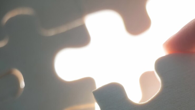 Animation of white pieces of puzzle on white background