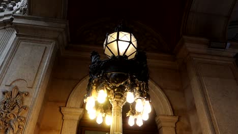 close-up shot of a vintage lamp standing in ancient palace, palacio da bolsa of porto