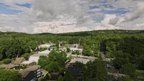 highlands north carolina aerial v7 cinematic drone flyover town center capturing quaint community surrounded by beautiful lush green mountainscape in summer - shot with mavic 3 cine - july 2022