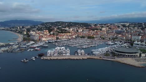 wide angle establishing drone shot cannes city and port in france