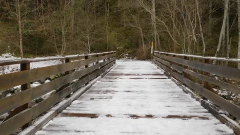 point of view video walking across snow covered bridge