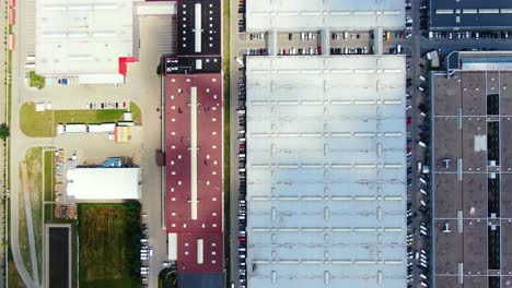 Aerial-footage-of-a-large-shopping-centre-and-car-parks-located-in-the-city