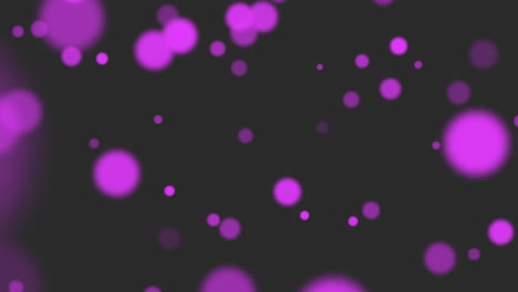 Flying-purple-round-particles-with-glitters-on-fashion-black-gradient