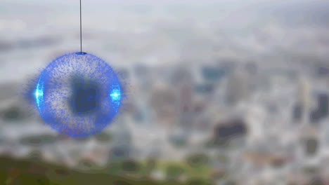 animation of blue glowing bauble over blurred cityscape