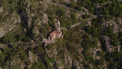 church of our lady of remedy on mountain slope above kotor, aerial