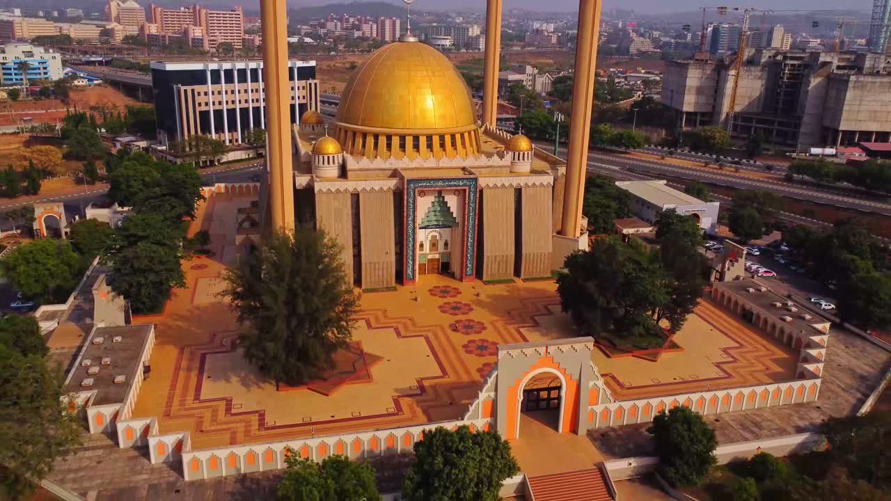 Beautiful aerial of the stunning Abuja National Mosque in Nigeria, Africa. Drone slowly pulls back to reveal the beautiful view