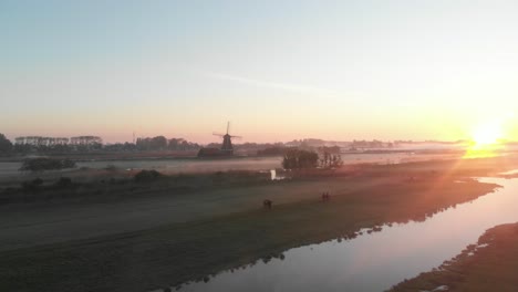 Windmill-in-a-foggy-morning-in-holland-Cinematic-Drone-Aerial-in-4K