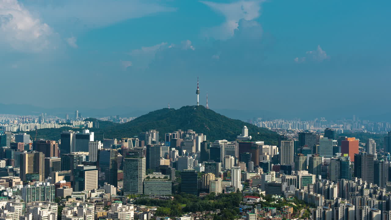 Zooming Out From Iconic N Seoul Namsan Tower Revealing Majestic Aerial City Urban Panorama of Downtown Seoul in Golden Hour - time lapse