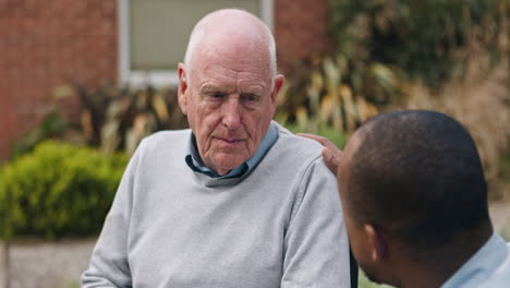 elderly man receives comfort from caregiver