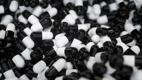 pile of black and white capsules