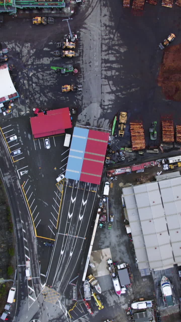 Vertical drone shot above a timber yard at Shakespeare Bay, in New Zealand