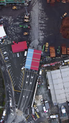 vertical drone shot above a timber yard at shakespeare bay, in new zealand