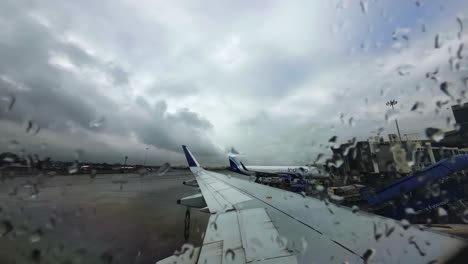 rain view from flight window in chhatrapati shivaji maharaj international airport in mumbai