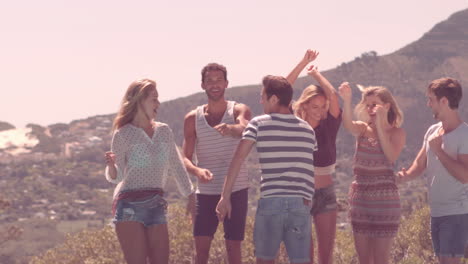 happy friends dancing by the pool