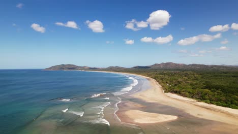 extensive and vast beach of the tamarindo coastline area on sunny day, costa rica