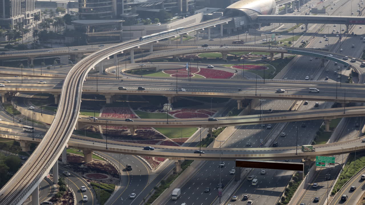 High Angle Time Lapse of Dubai Highway Interchange with Cars and Metro