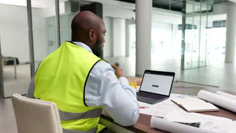 young construction manager working on a laptop