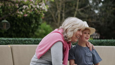 grandmother and grandson bonding in the garden