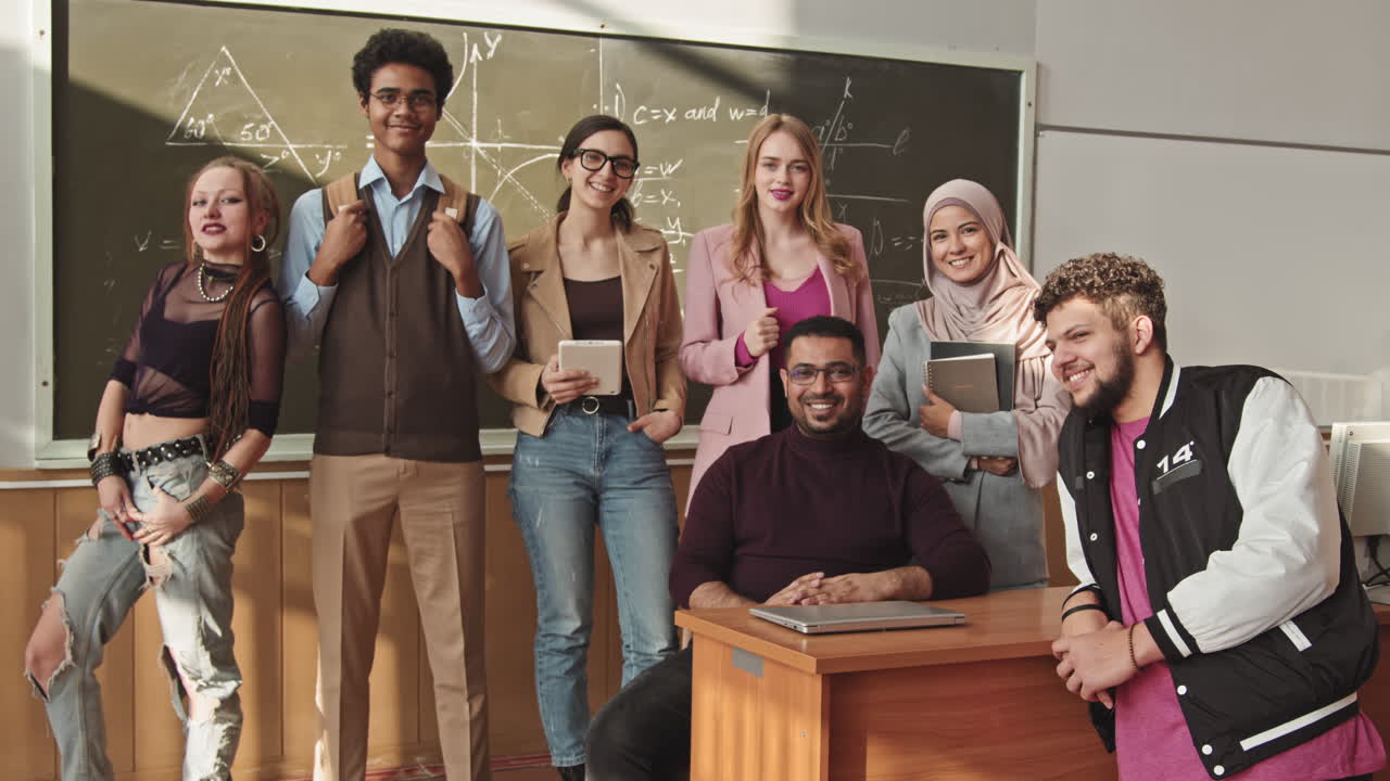 Portrait Of Cheerful Students and Maths Professor at Blackboard