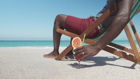 Senior-man-on-deck-chair-with-a-cocktail