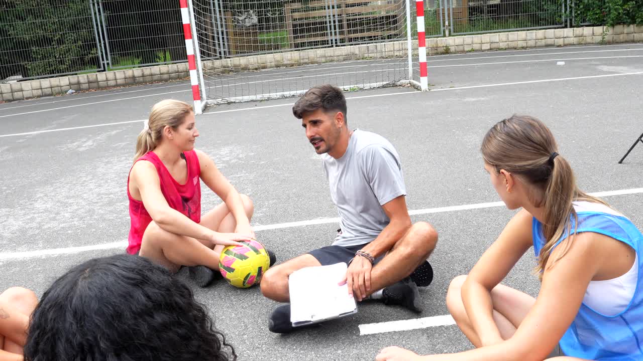 Group of people sitting on the ground