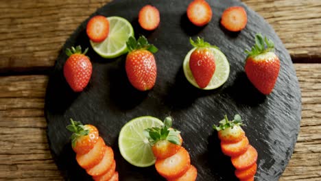 strawberries and lemon placed on wooden surface 4k 4k