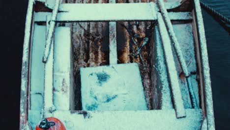lake boat in snow tilt up reveal