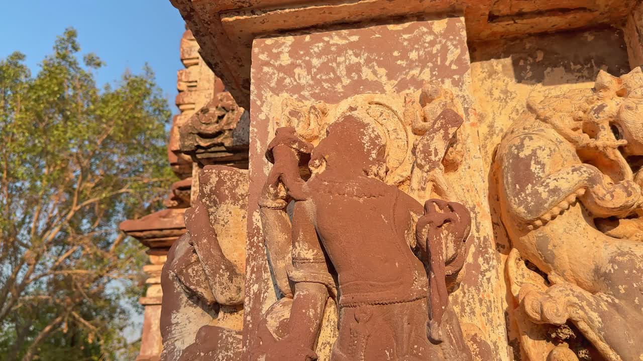 Broken and headless statue of hindu deities at the temple in india