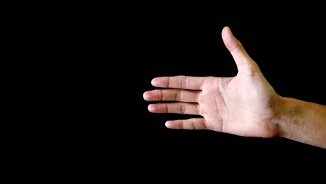 male hand gesture on black background.