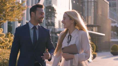business people walking and talking in the city