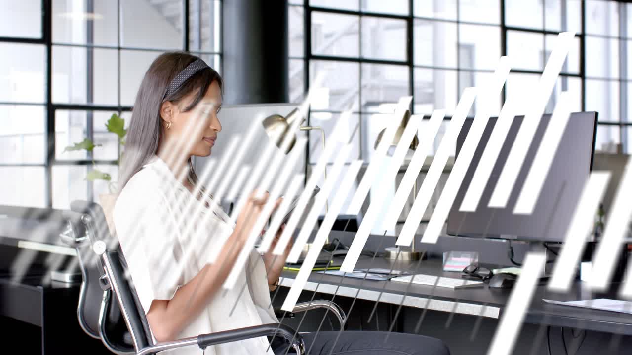 Office worker tapping tablet and swiping, initiating diagonal white bars revealing business content