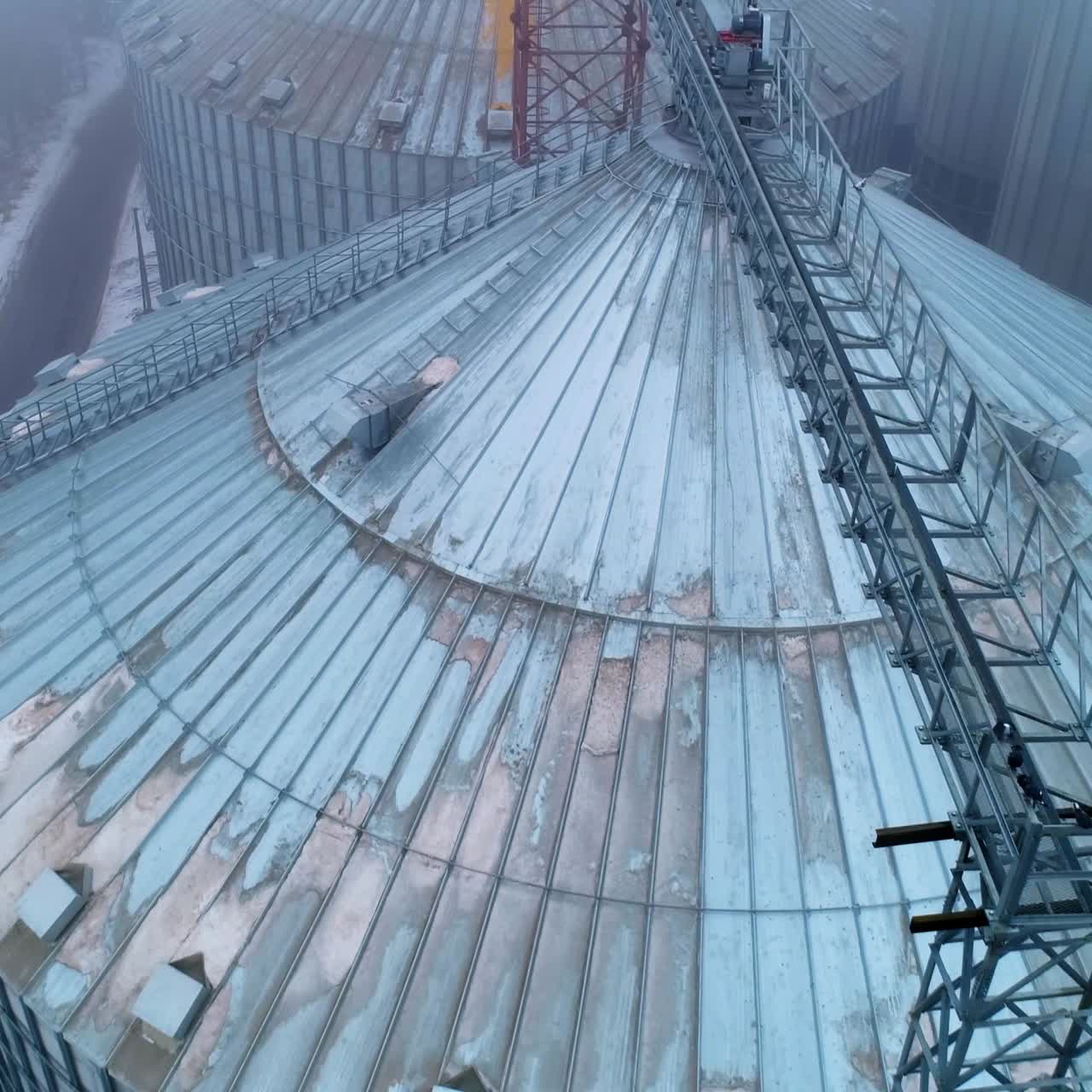 Big agricultural elevator silos. Modern metal storage elevator construction
