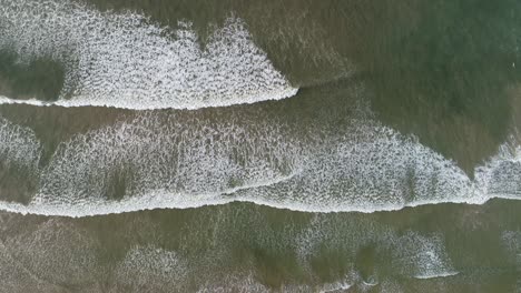 aerial view. aerial drone footage of ocean waves in the morning
