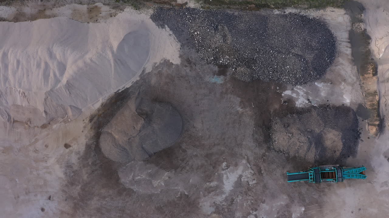 Aerial View of Quarry with Stone Crushing Machine and Material Piles