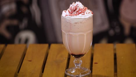 cold homemade glass of strawberry milkshake with whipped cream vanilla ice cream and topping - slider movement