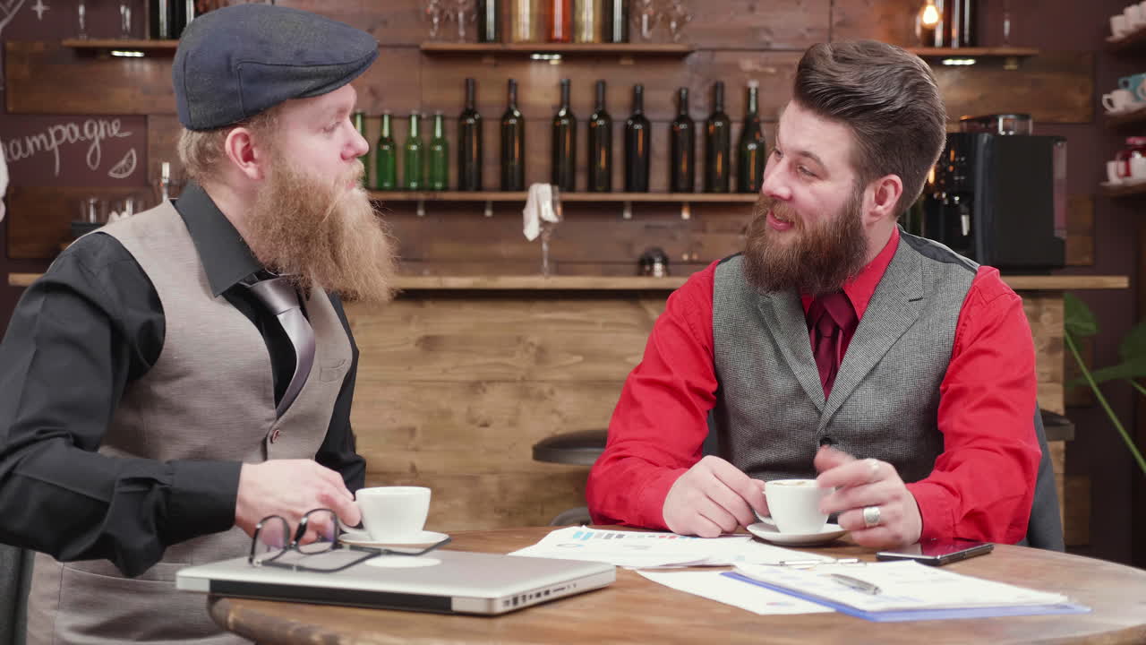 Businessmen having coffee at a cafe