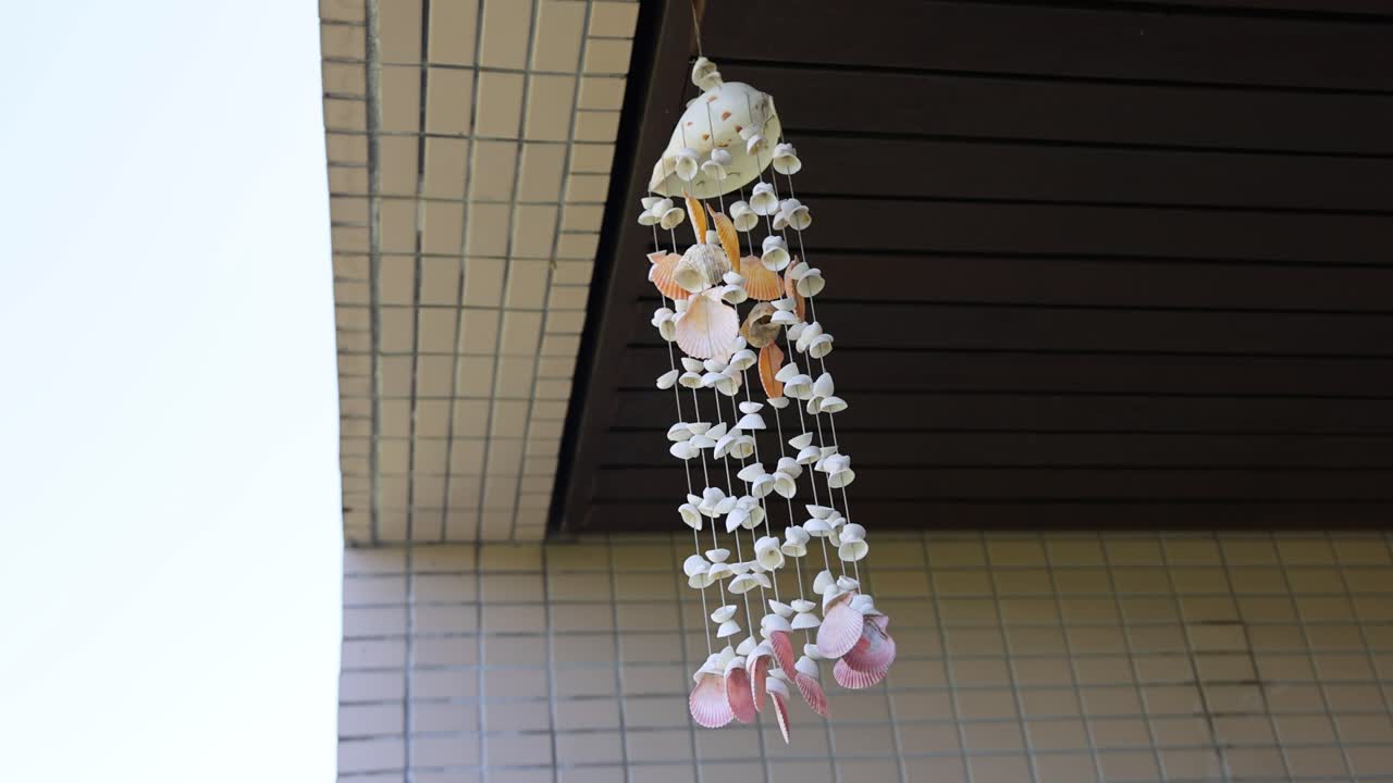 A hanging floral arrangement sways gently indoors.