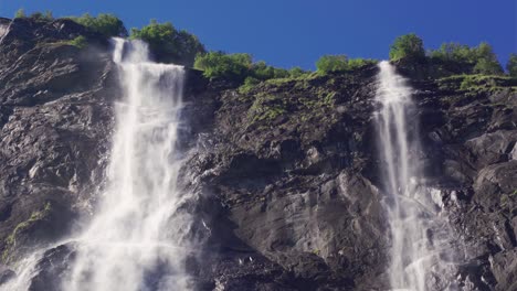 a breathtaking view of the seven sisters waterfalls in the geiranger fjord, norway