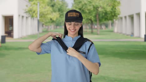 happy indian female security guard getting ready for duty