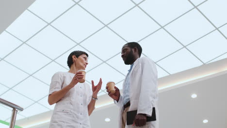 Doctors-talking-with-coffee-cups