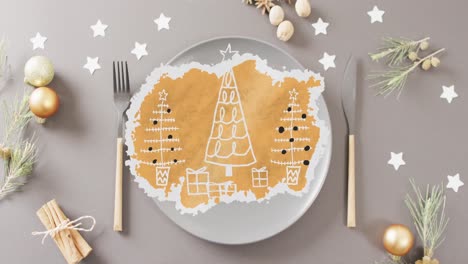 Animation-of-christmas-place-setting-with-decorations