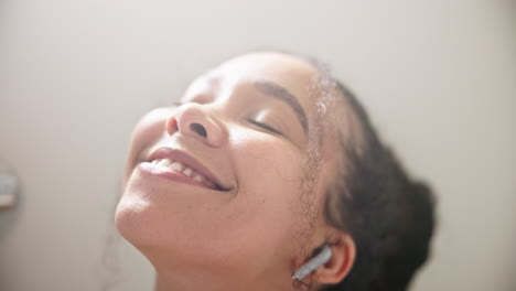 music, relax or happy woman in a bath in hotel