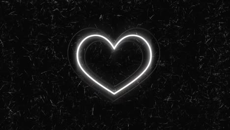 animación de corazones de neón coloridos sobre un fondo negro